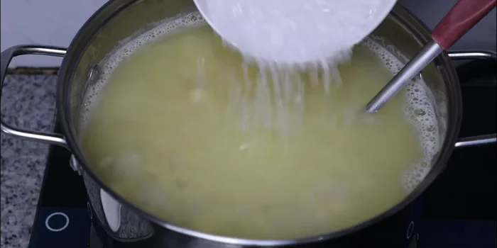 Add rock sugar (or granulated sugar) and cook until dissolved.