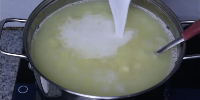 Add 300ml of the coconut milk and simmer for 2-3 minutes until the flour is cooked through.