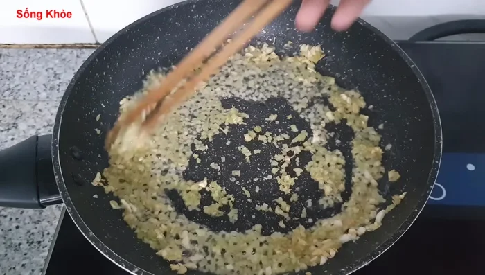 Add the lemongrass and stir-fry until fragrant. Add a ladle of water to help cook the meat.