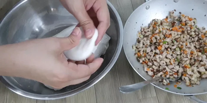 Shape the cakes: Take a portion of the dough, press it flat, and shape it into a triangle or circle. (338.139)