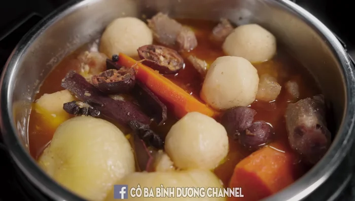 Finish the broth: Skim off fat from the pressure cooker. Filter the broth. Add more water to reach desired volume. Add lotus root and eggplant. Season with prepared hot pot seasoning. Add taro.