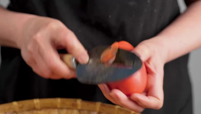 Prepare vegetables: peel and chop tomatoes, carrots, and potatoes.