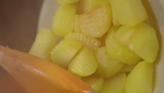 Add fried carrots, potatoes, green beans (if using), and pineapple to the chicken stew. Season to taste with chicken seasoning powder.