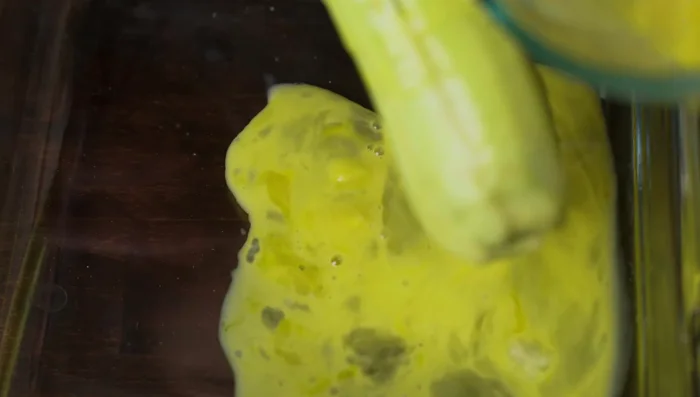Coat eggplant strips in egg, then in flour mixture.