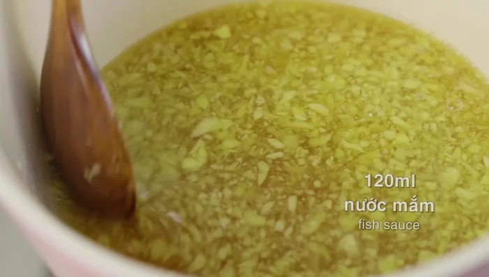 Once boiling, add 120ml of fish sauce.