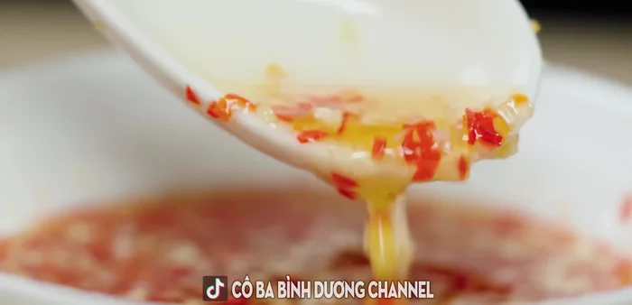 Prepare the fish sauce (recipe detailed in the video).