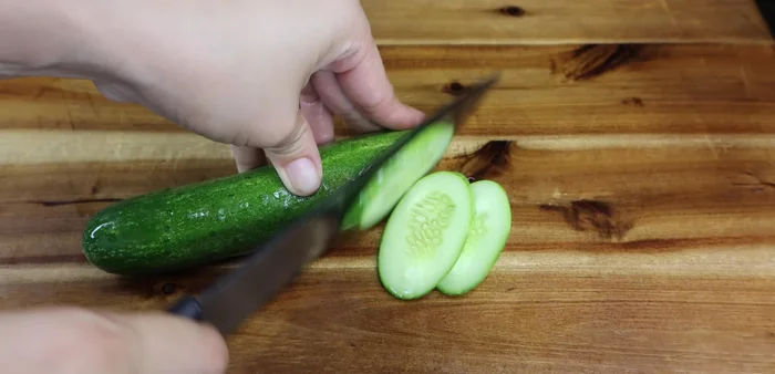 Serve: Serve hot with rice, cucumbers, and tomatoes.