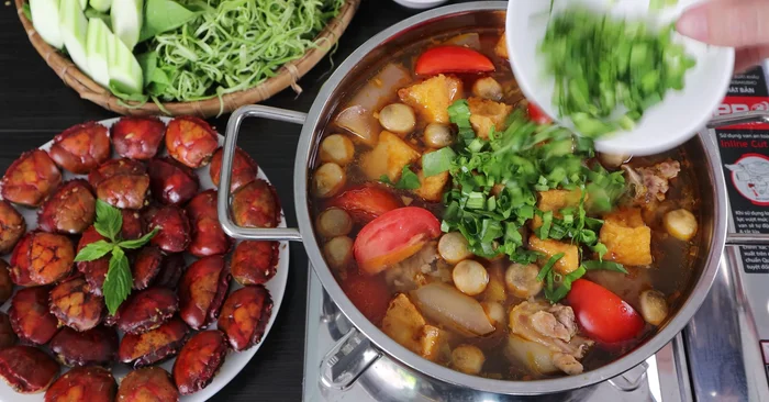 Serve the hotpot with the steamed crab cakes, vegetables (spinach, squash, luffa), vermicelli, and your choice of dipping sauce (fish sauce or shrimp paste).