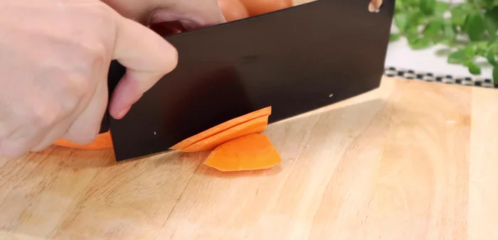 Prepare the carrots: Cut the carrots into small pieces.