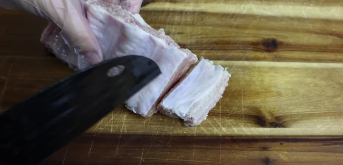 Score the ribs to allow for even marinating and cooking.