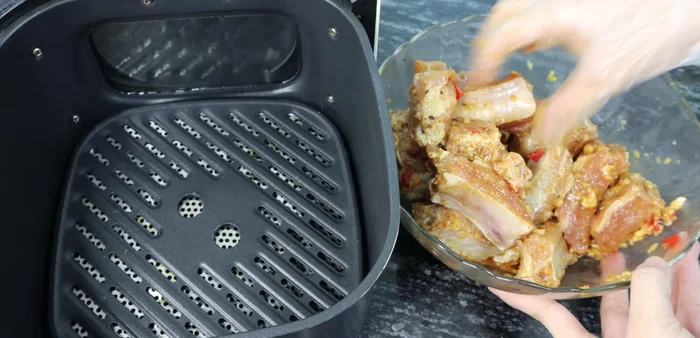 Preheat the air fryer to 180 degrees. Arrange the ribs in the air fryer.