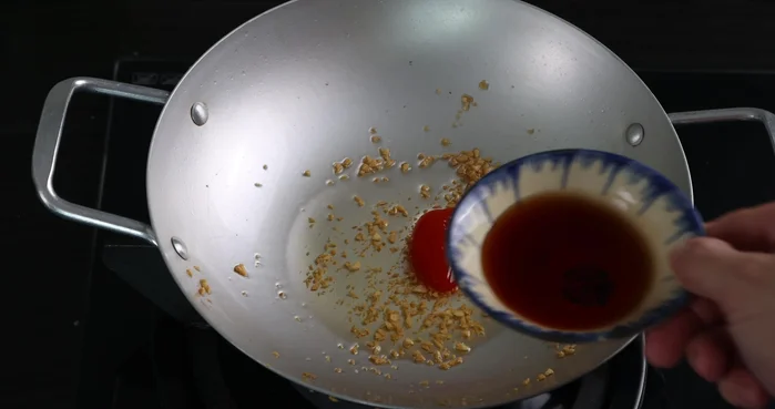 In a pan, combine chili sauce (1/2 tablespoon), fish sauce (3 tablespoons), sugar (3 tablespoons), and vinegar (1/2 tablespoon). Cook until dissolved.
