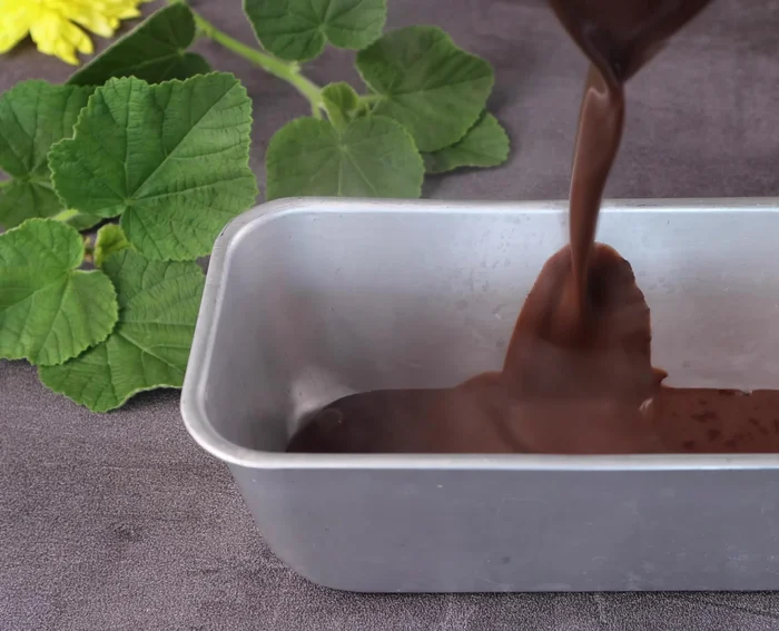 Pour the hot jelly mixture into a prepared container.