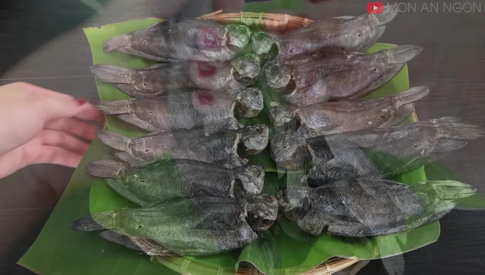 Remove the dried fish from the string.