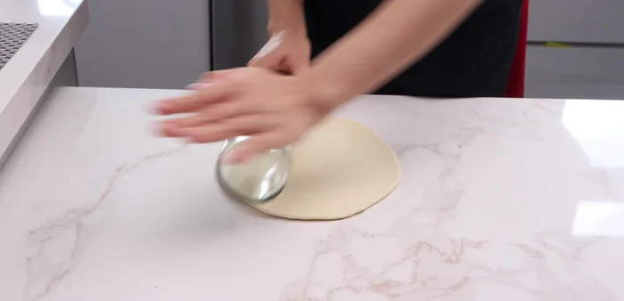Roll out the dough into a circle.
