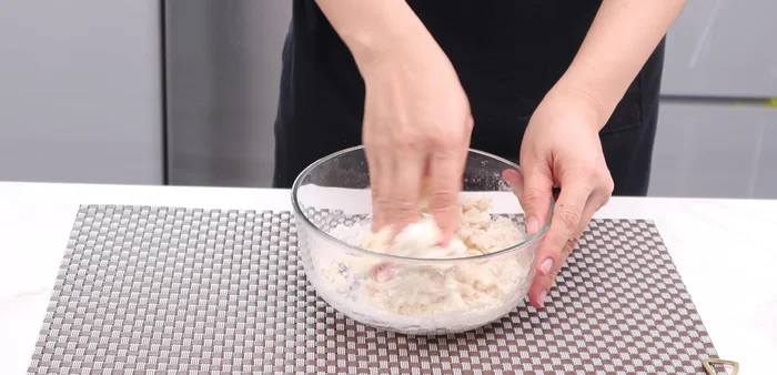Add a little salt and knead the dough until smooth.