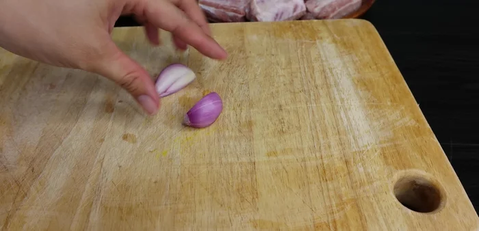 Crush one large purple onion. This will be used to blanch the ribs.