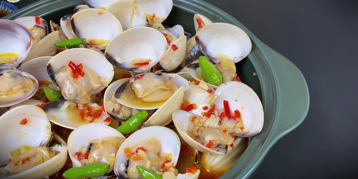Serve hot with bread for dipping. Garnish with additional chili peppers as desired.