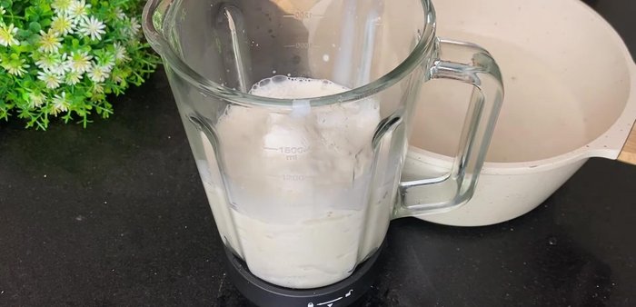 Gradually add a portion of the cooled milk mixture to the blended coconut wax, blending until smooth and creamy. Add more milk mixture as needed to achieve a smooth consistency, avoiding overworking the blender.