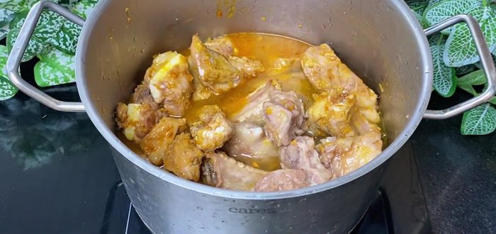 Add coconut water and regular water to the pot.