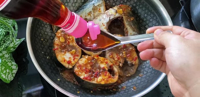 Add fish sauce, seasoning powder, rock sugar, and chili sauce. Reduce heat to low.