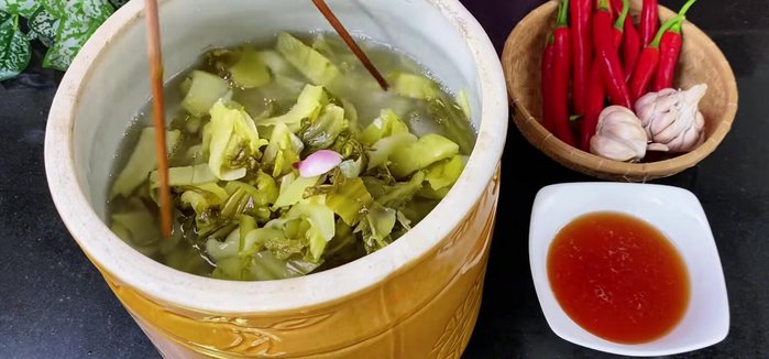 Prepare the ingredients: Gather pickled cabbage, garlic, chili peppers, sugar, fish sauce, and water.