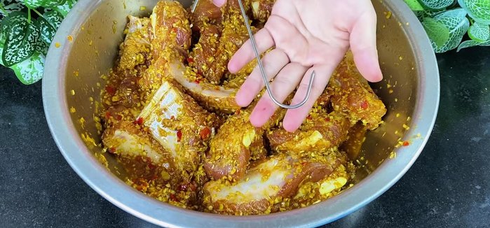 Hang the marinated ribs on hooks to dry in direct sunlight for one day, turning occasionally to ensure even drying.
