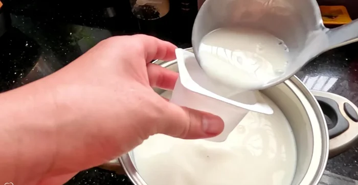 Add yogurt starter: Remove from heat and stir in your chosen amount of yogurt starter (127.56). Stir well to dissolve completely (139.28).