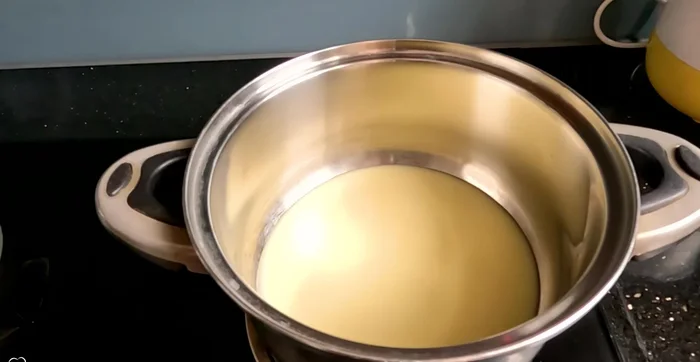 Heat condensed milk: In a pot, heat ½ can of condensed milk (or use sugar instead) until warm (69.72).