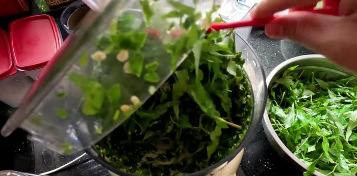 Mix well, then add the remaining Vietnamese coriander and grind until smooth.