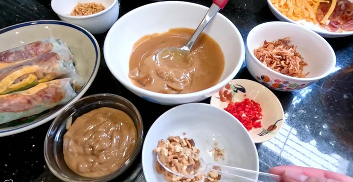 Serve: Dip spring rolls in the prepared sauce, and garnish with extra peanuts, fried shallots, and chili (optional).