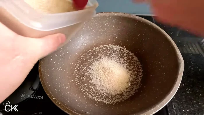 Simmer the brine with 5 spoons of sugar until the sugar dissolves and turns caramel yellow. Then, add the soy sauce and fish sauce. Boil for 3-5 minutes, skimming off foam.