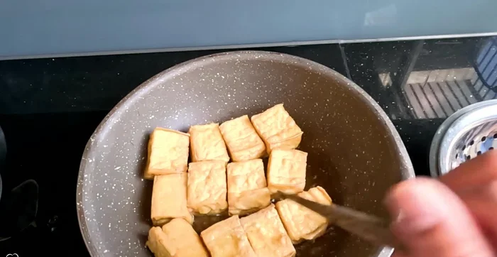 Fry the taro until golden brown.