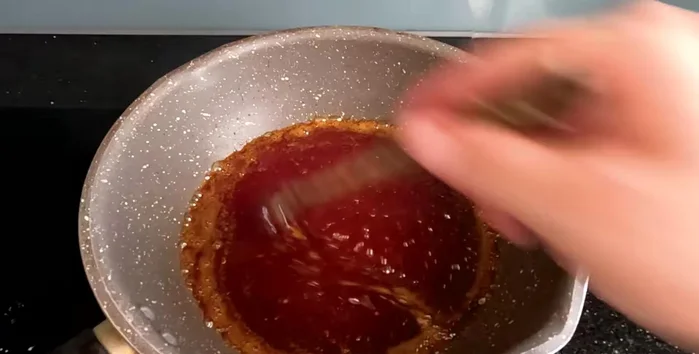 Continue cooking until the sugar turns a caramel color. Monitor closely to prevent burning.
