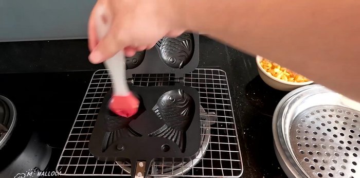 Grease the mold: Optionally, brush a thin layer of butter inside the heated mold (385.44).