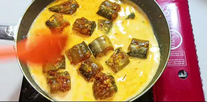 Add coconut milk and simmer: Pour in coconut milk. Reduce heat to medium, simmer, and stir occasionally until the sauce thickens slightly. Adjust seasoning as needed.