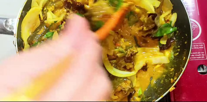 Finish and serve: Reduce heat to low, simmer for 30 seconds. Turn off the heat. Garnish with roasted peanuts, sliced chili peppers, and remaining cilantro and coriander.