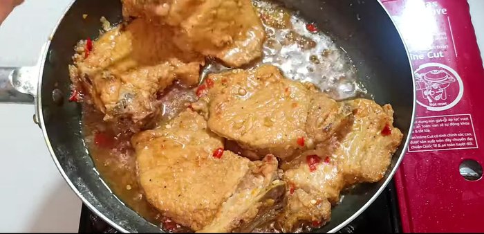Continue to braise until the liquid is almost dry, turning ribs frequently for even cooking and color.