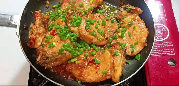 Add chopped green onions, stir, and cook until heated through.