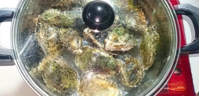 Boil the oysters in a pot with a little water for about 1 minute to make it easier to separate them from their shells. Let cool.