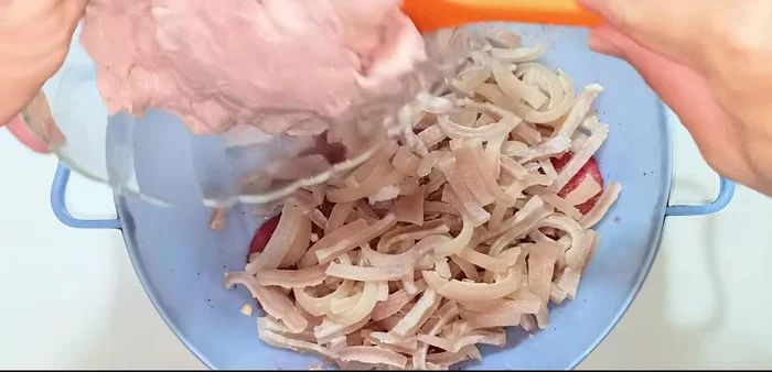 Combine all ingredients: Add the marinated meat, pork skin, remaining minced garlic and onion, black pepper or peppercorns, sugar, MSG, fish sauce, and tapioca starch to a bowl. Mix well, ensuring even distribution of spices.