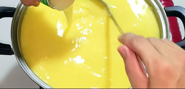 Add condensed milk, continue stirring.
