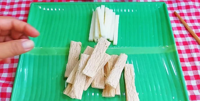 If using, insert green onion sticks into the vegetarian ribs.