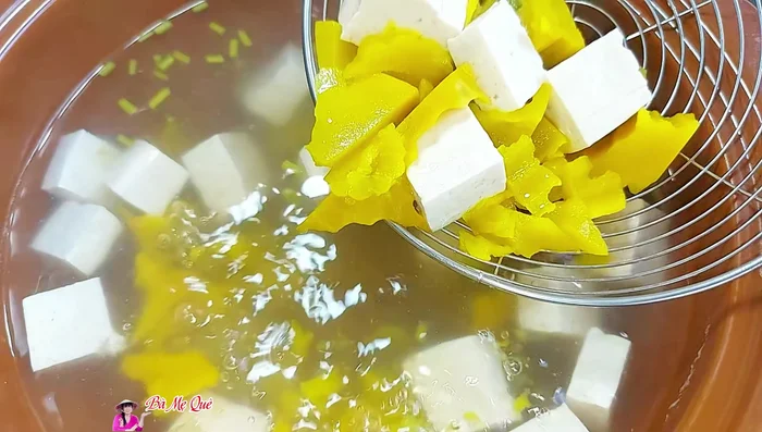 Remove cooked pumpkin pieces and blend them until smooth.