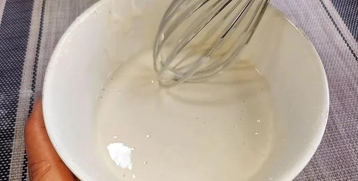 Dip the cauliflower in the flour batter to coat evenly.