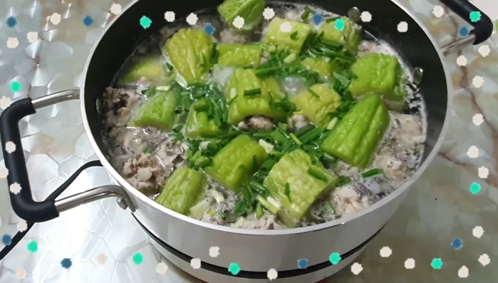 Sauté onions and garlic: Add onions and garlic to a pot and sauté until fragrant. (This step is inferred; no exact time is given in the transcript)