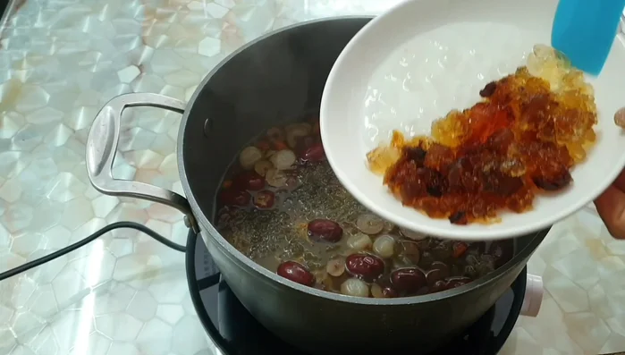 Add snow fungus, peach gum, lotus seeds, and cook for another 5 minutes.