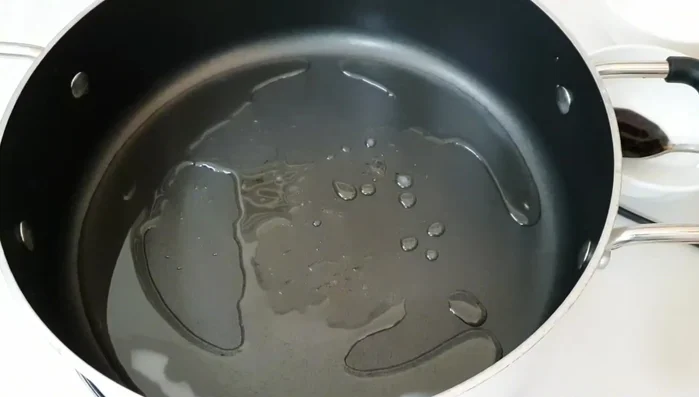 Heat oil in a wok or frying pan.
