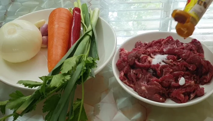 Add the beef and stir-fry until browned. (No specific instructions in transcript)