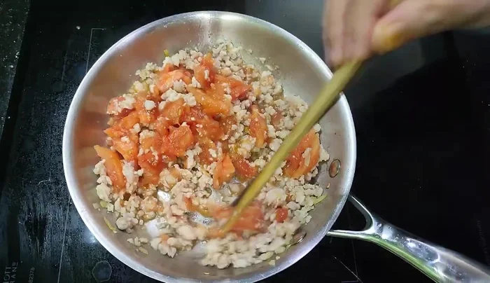Simmer the mixture for about 15 minutes until the spices are softened.